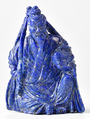 Lot 427 - A Chinese carved lapis lazuli figure of a...