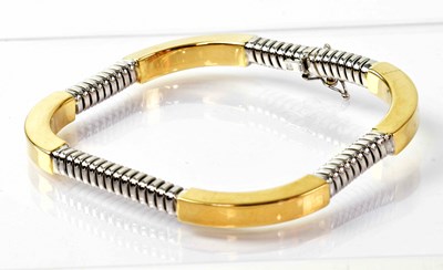 Lot 907 - A 14ct yellow and white gold alternating snake...