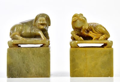 Lot 1110 - A pair of Chinese carved soapstone seals...