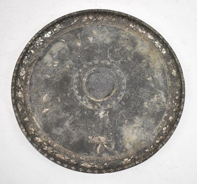 Lot 522 - An Indian base metal circular tray with white...