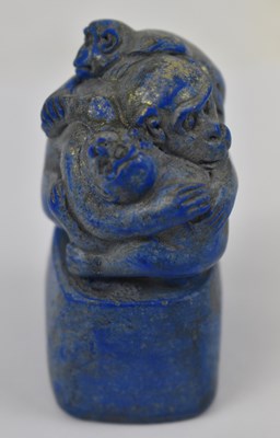 Lot 649 - A Chinese lapis lazuli seal surmounted with...