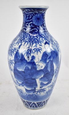 Lot 637 - A Japanese blue and white baluster form vase,...