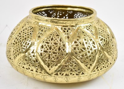 Lot 510 - An Eastern pierced brass circular bowl,...