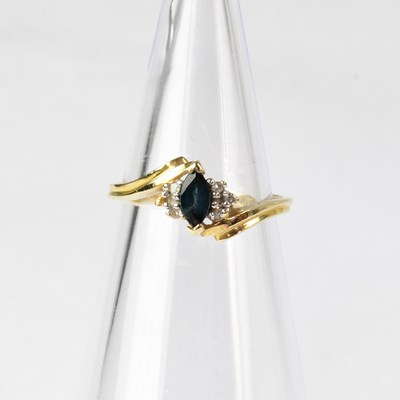Lot 850 - A 14ct gold sapphire and diamond set ring on...