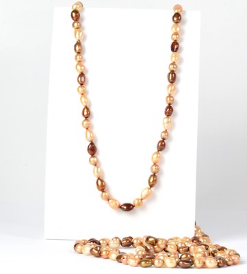 Lot 1010 - A long string of Baroque tiger pearls, length...