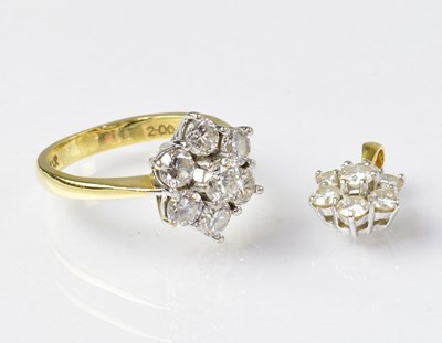 Lot 980 - An 18ct gold ring, size P 1/2, and matching...