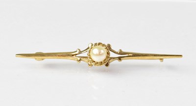 Lot 925 - A 9ct gold bar brooch set with central pearl...