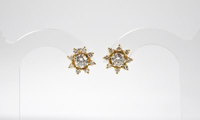 Lot 962 - A pair of 18ct gold diamond and stud earrings...