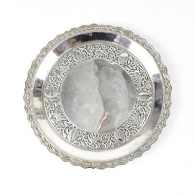 Lot 750 - An Indian white metal plate embossed with...