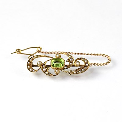 Lot 930 - A yellow metal brooch set with a central...