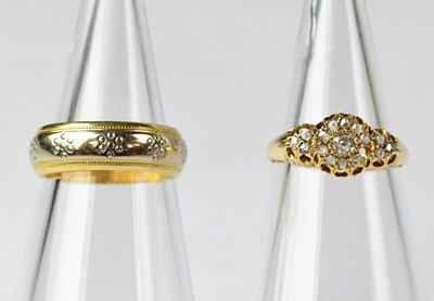 Lot 822 - An 18ct gold diamond cluster ring set with...