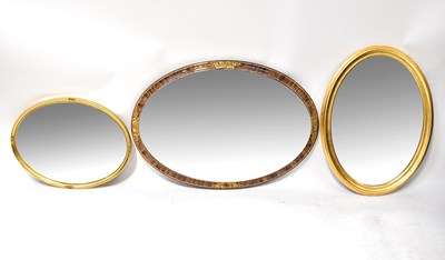 Lot 87 - Three contemporary wall mirrors comprising an...