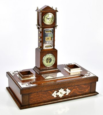 Lot 1332 - A late Victorian oak desk stand with silver...