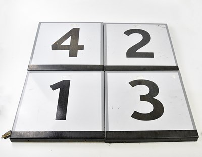 Lot 5078 - A set of four train station enamelled platform...