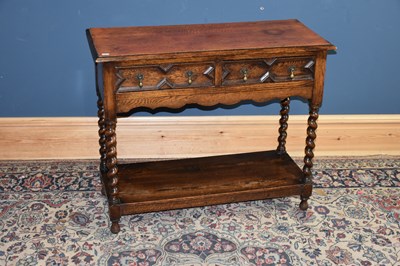 Lot 6604 - A 1920s oak two drawer hall table, width 92cm,...