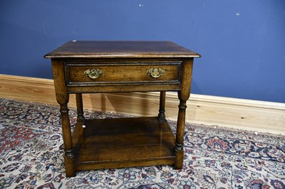 Lot 6527 - A reproduction oak single drawer two tier side...