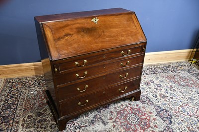 Lot 6605 - A 19th century mahogany bureau with fall front,...