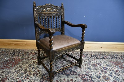 Lot 6538 - An early 20th century carved oak open arm...