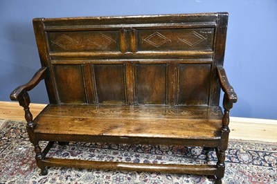 Lot 6512 - An 18th century oak settle with panel back,...