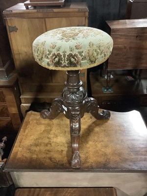 Lot 6699 - A Victorian carved walnut revolving piano...