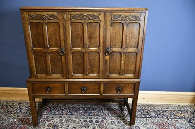 Lot 6511 - WARING & GILLOW; an early 20th century oak...