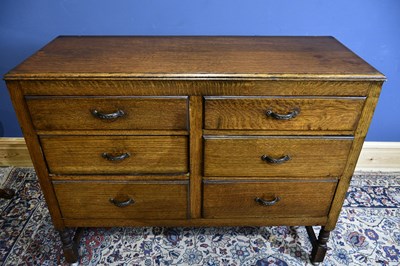 Lot 6734 - An early 20th century oak six drawer sideboard,...