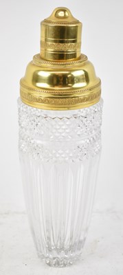 Lot 588 - A clear glass cocktail shaker with gold plated...