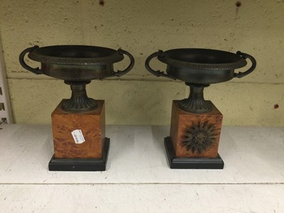 Lot 680 - A pair of 20th century bronze twin handled...