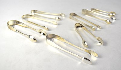Lot 713 - Eight pairs of hallmarked silver sugar nips