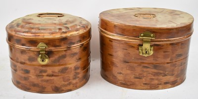Lot 512 - Two copper effect oval hat tins with brass...