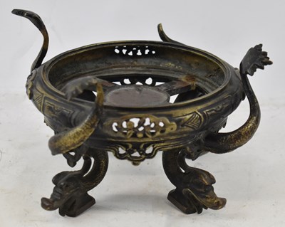 Lot 650 - A Japanese bronze censer base decorated with...
