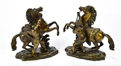 Lot 1544 - AFTER COUSTOU; a pair of bronze Marly horses,...