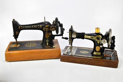 Lot 1496 - Two vintage sewing machines, including a...