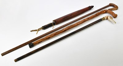 Lot 1384 - Three vintage walking sticks and a Japanese...