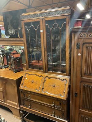 Lot 6579 - A 1920s oak bureau bookcase, the upper section...