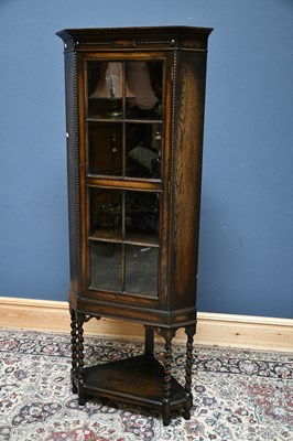 Lot 2539 - An early 20th century oak freestanding corner...