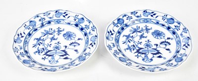 Lot 2126 - MEISSEN; a pair of 'Onion' pattern cabinet...