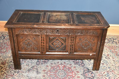 Lot 6519 - An 18th century carved and panelled oak coffer...
