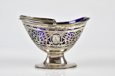 Lot 2386 - A George III pierced oval basket with swing...