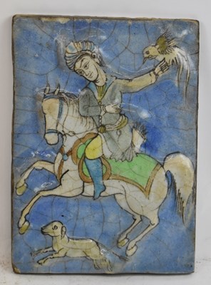 Lot 645 - An 18th/19th century Persian rectangular tile...