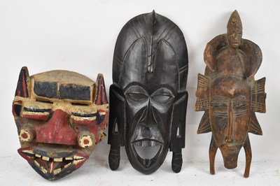 Lot 452 - A carved tribal mask with polychrome...