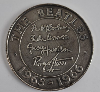 Lot 901 - THE BEATLES; a commemorative medallion dated...