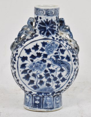 Lot 636 - A small circa 1900 Chinese blue and white moon...