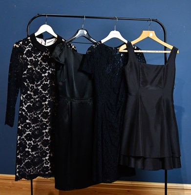 Lot 904 - DKNY; a black lace short dress with underskirt,...