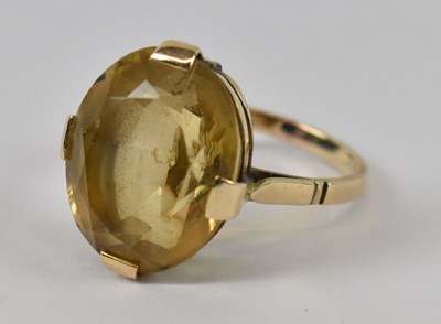 Lot 816 - A yellow metal citrine set dress ring, size N/O.
