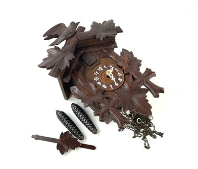 Lot 6433 - A carved 20th century cuckoo clock, decorated...