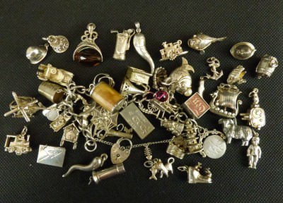 Lot 935 - A vintage silver charm bracelet