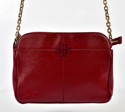 Lot 869 - TORY BURCH; a red pebbled patent leather...