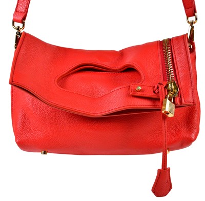 Lot 883 - TOM FORD; a red grained leather Alix clutch...