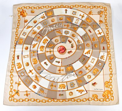 Lot 936 - CARTIER; a 100% silk cream, gold, red and blue...